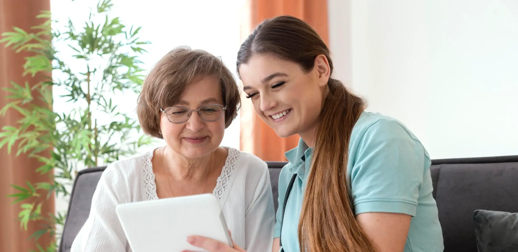 Caring caregiver with elderly person